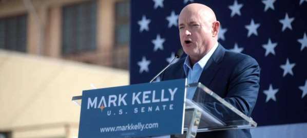 Mark Kelly speaking with supporters at a campaign rally.