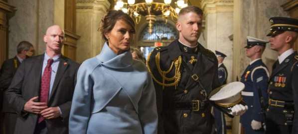 Melania Trump, escorted by a U.S. Marine at Donald Trump's inauguration. 