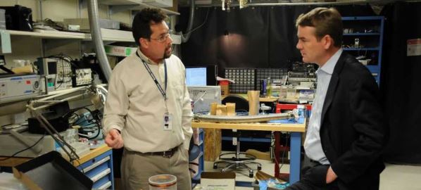 Michael Bennet speaking with Dr. John Kitching at the NIST in Boulder, CO.