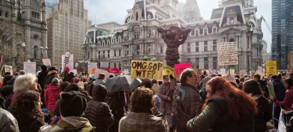 Thousands protest on the streets of Philadelphia for health care and the environment.