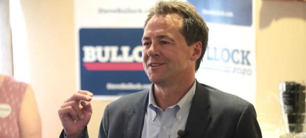 Governor Steve Bullock speaking with supporters at a house party in Des Moines, Iowa. 