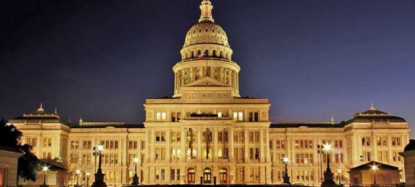 Texas State Capitol in Austin, TX at night.